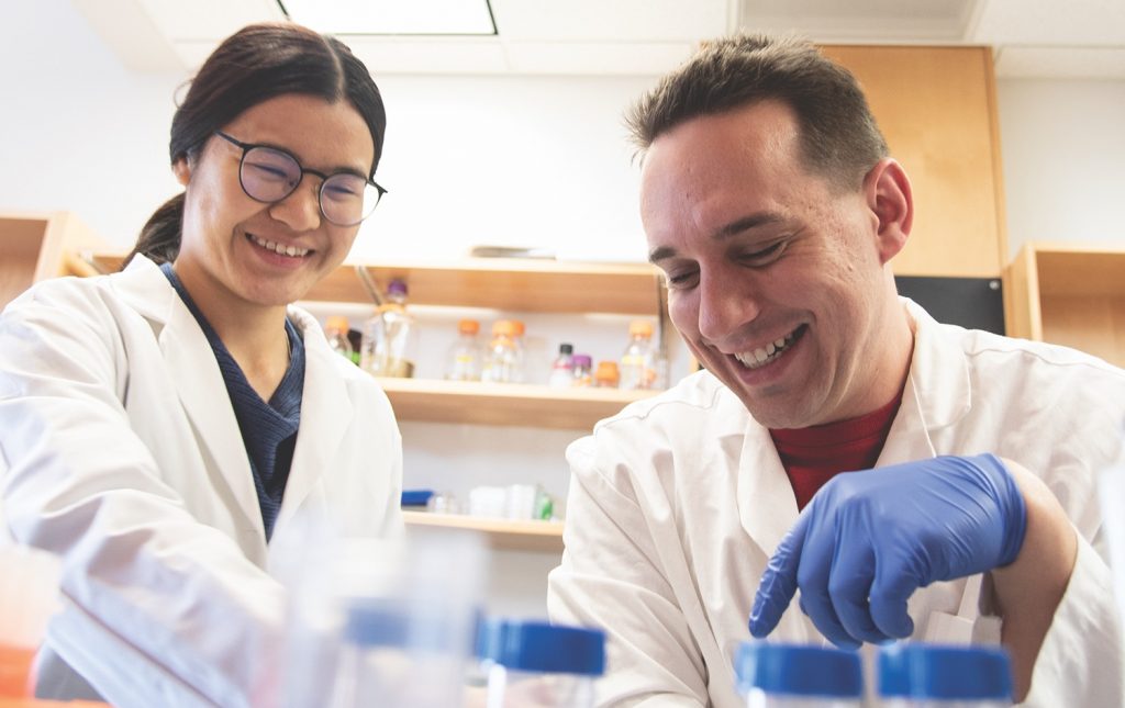 Phil Huss (right) and Chutikarn Chitboonthavisuk in the Raman Lab