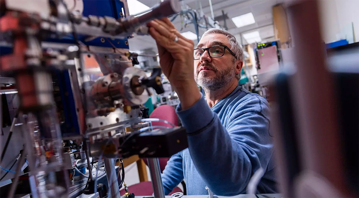 Photo of Mike Westphal working on lab equipment.