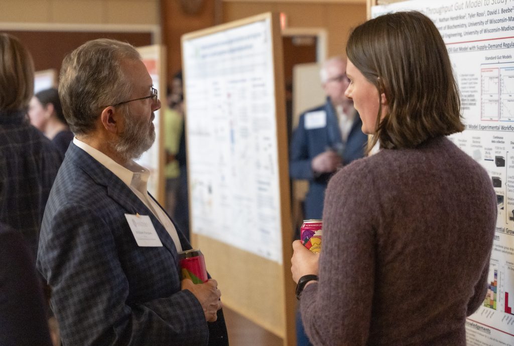 Dean Karpus (left) and other guests talked with BTP trainees about their research, internship interests, and career goals at the annual banquet.