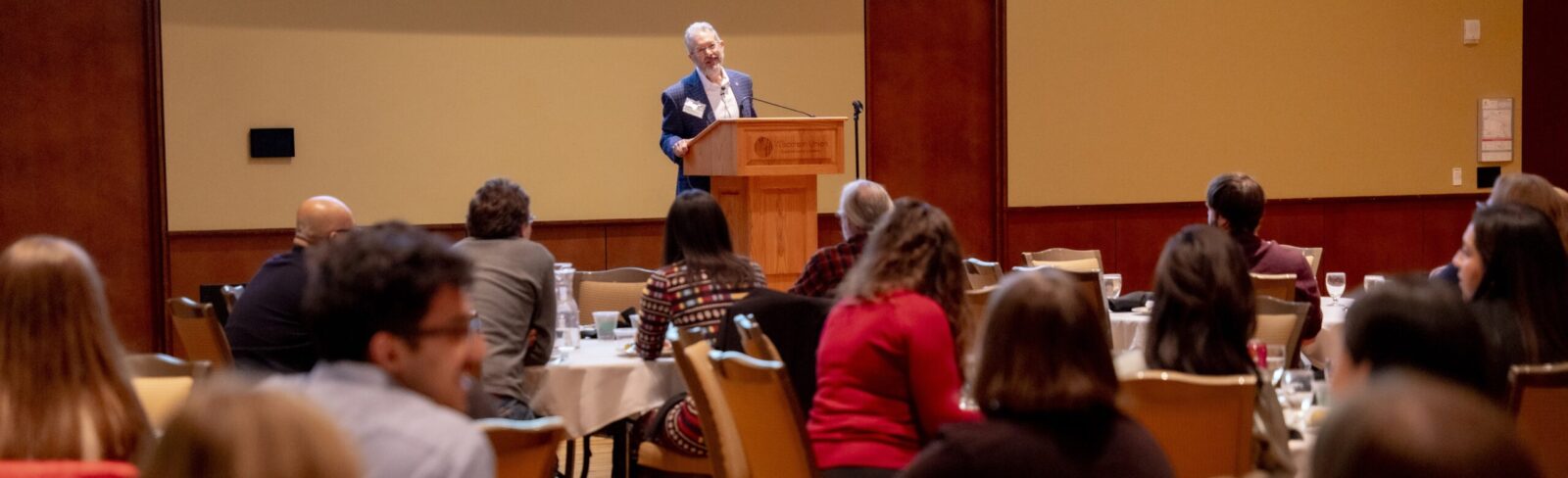 Industry visitor speaks at BTP winter banquet to group of students.